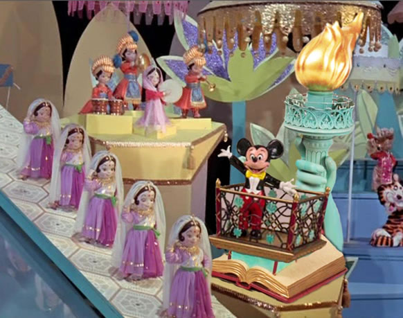 What is Mickey doing on the Small World ride?
